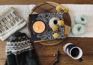 Weaving in ends and casting on with magazine and tea.